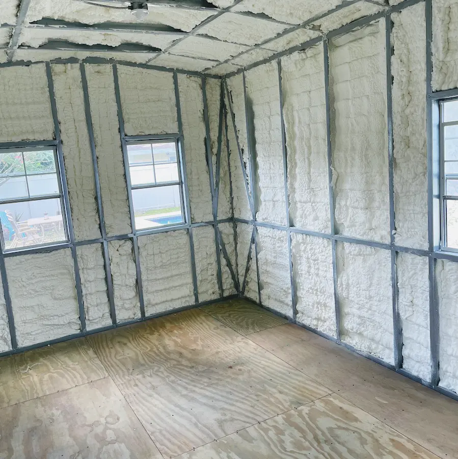 Closed-cell spray foam insulation applied to wall cavities in a residential project in Plumstead